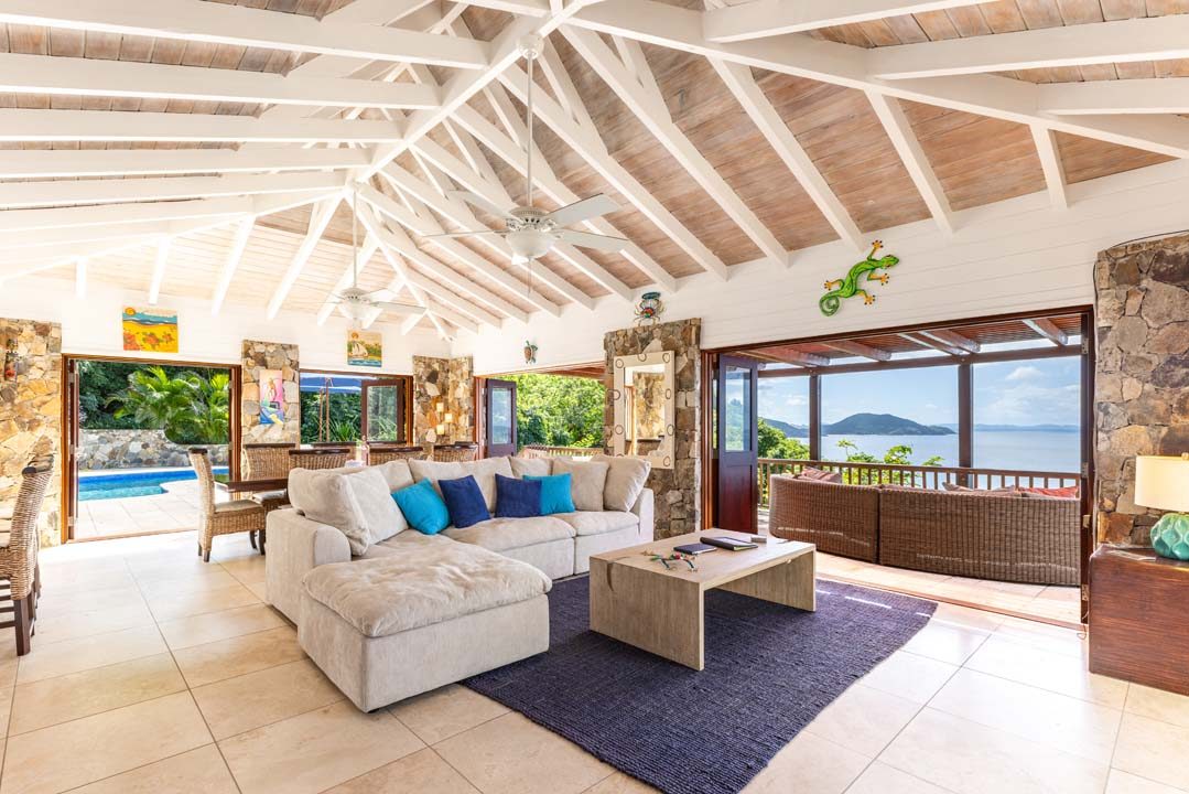 Great room with vaulted whitewashed beams and sectional sofa