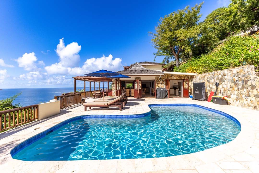 Closer view of the pool deck and villa